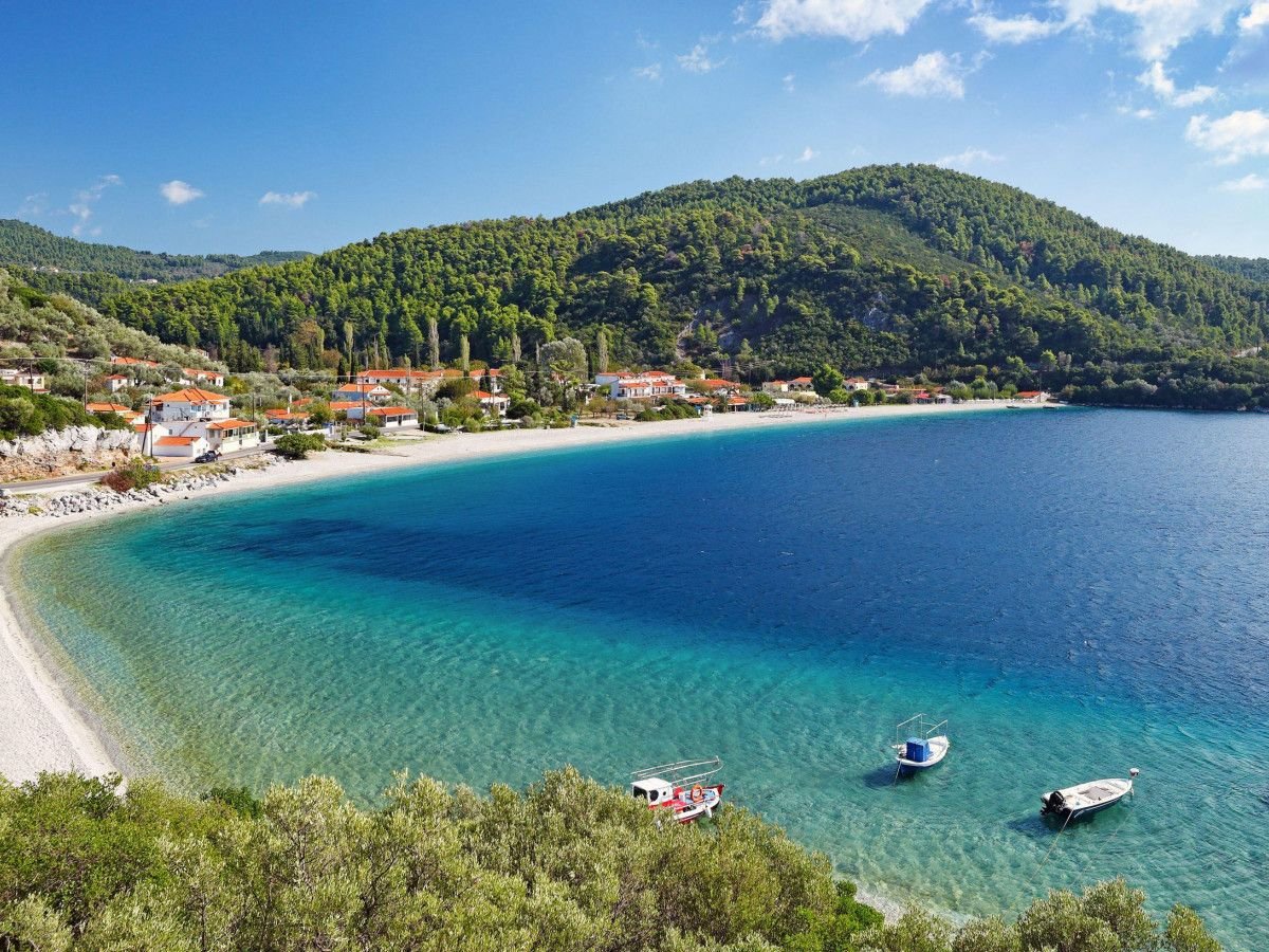 Beautiful sailing yacht near picturesque seacoast. Assos village Mediterranean  Sea, Greece. Summer vacation on Greek Island Stock Photo - Alamy