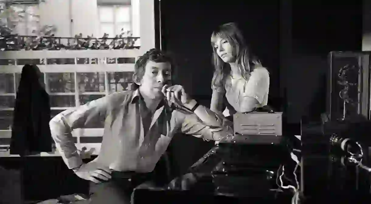 Serge Gainsbourg (1928-1991) and Jane Birkin (1946-) around a piano. Photography by Kelaidites circa 1969 Art - various