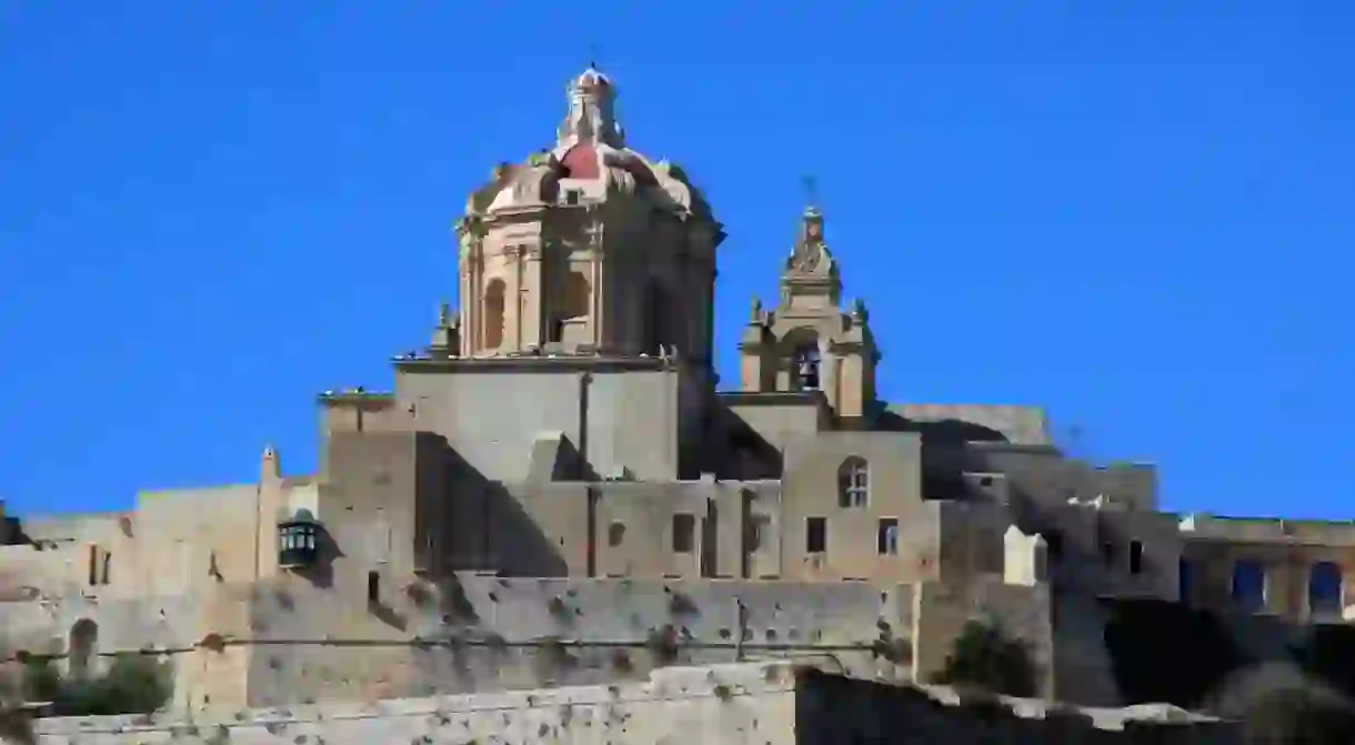 A view of the walls and towers of the Co Cathedral of the ancient city of Mdina, Malta