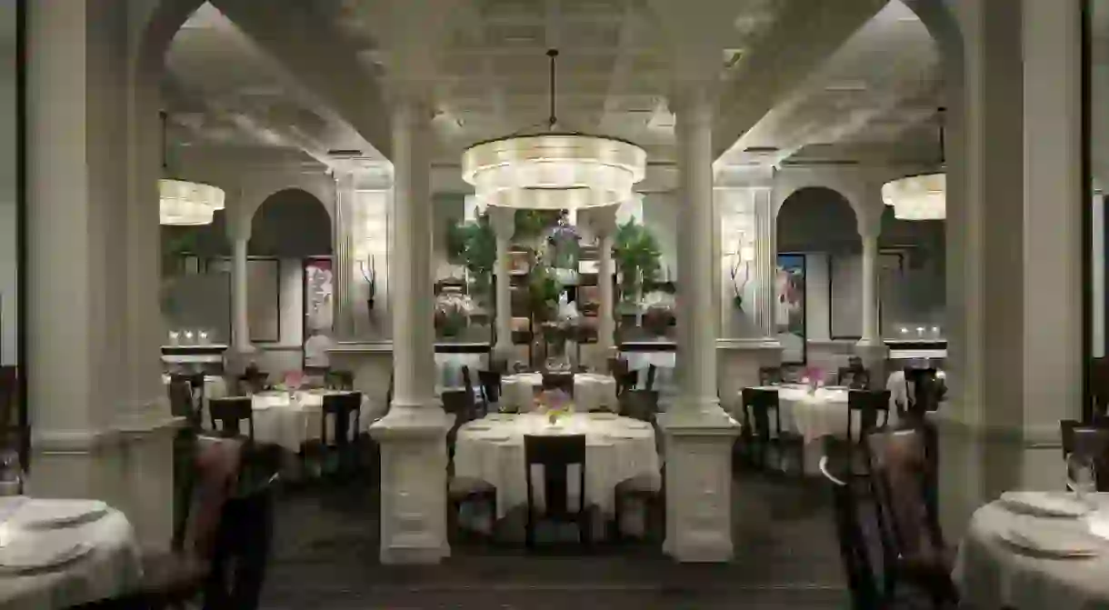 Front view of the main dining room decorated with mixed flowers at Daniel in NY