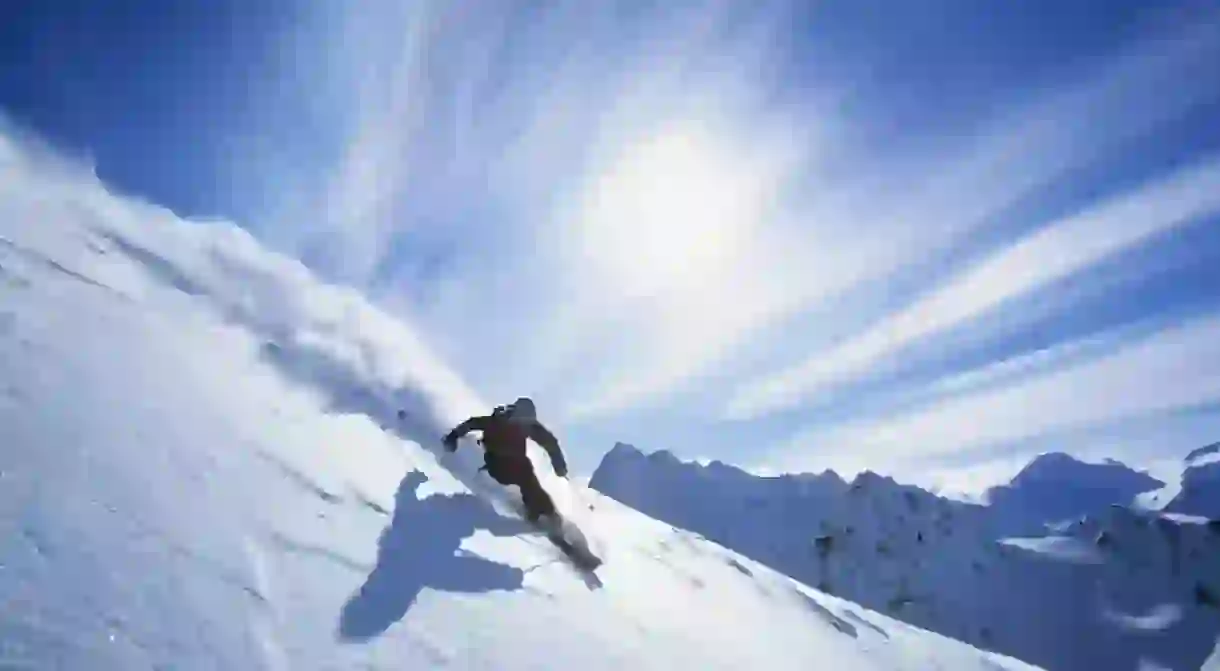 Skier skiing on fresh powder snow