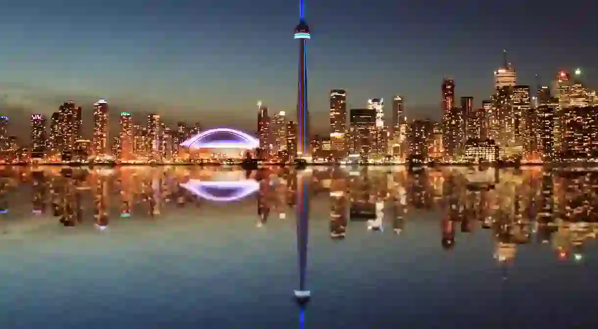 CN Tower - Toronto Skyline at night with a reflection in Lake Ontario