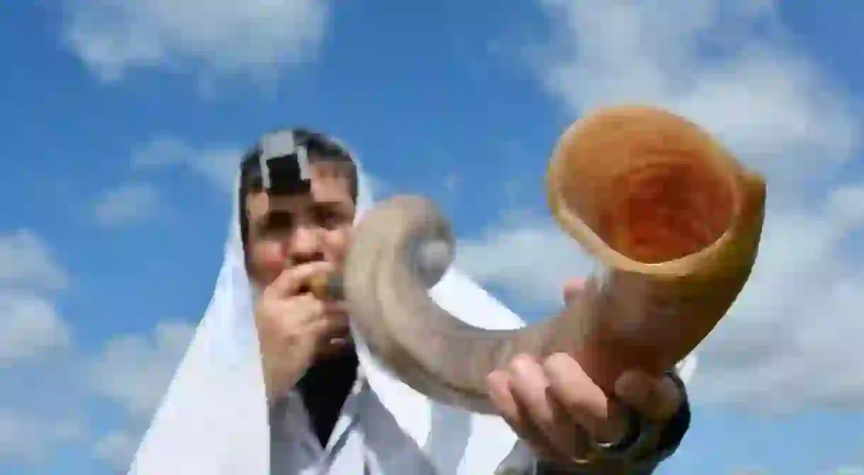 Jewish man blows Shofar