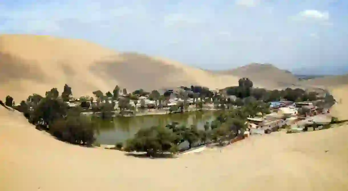 The Huacachina Oasis, in the desert sand dunes near the city of Ica, Peru