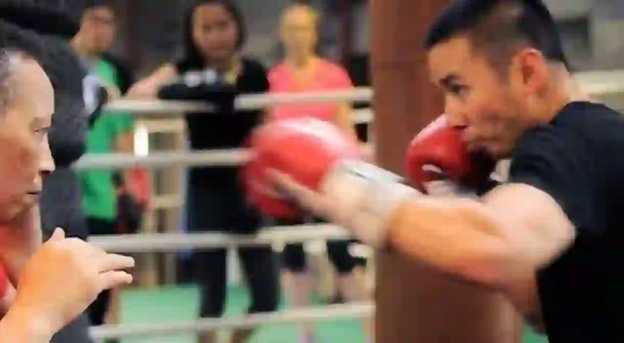 Michele Aboro, teaching boxing to student of the Aboro Academy. Explaining about to get the right distance,