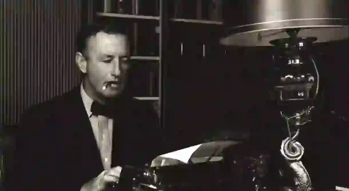 Ian Fleming at work on his golden typewriter