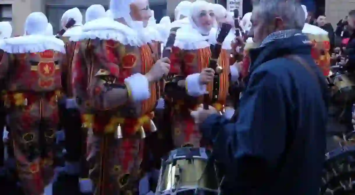 Gilles dancing in the streets with musicians