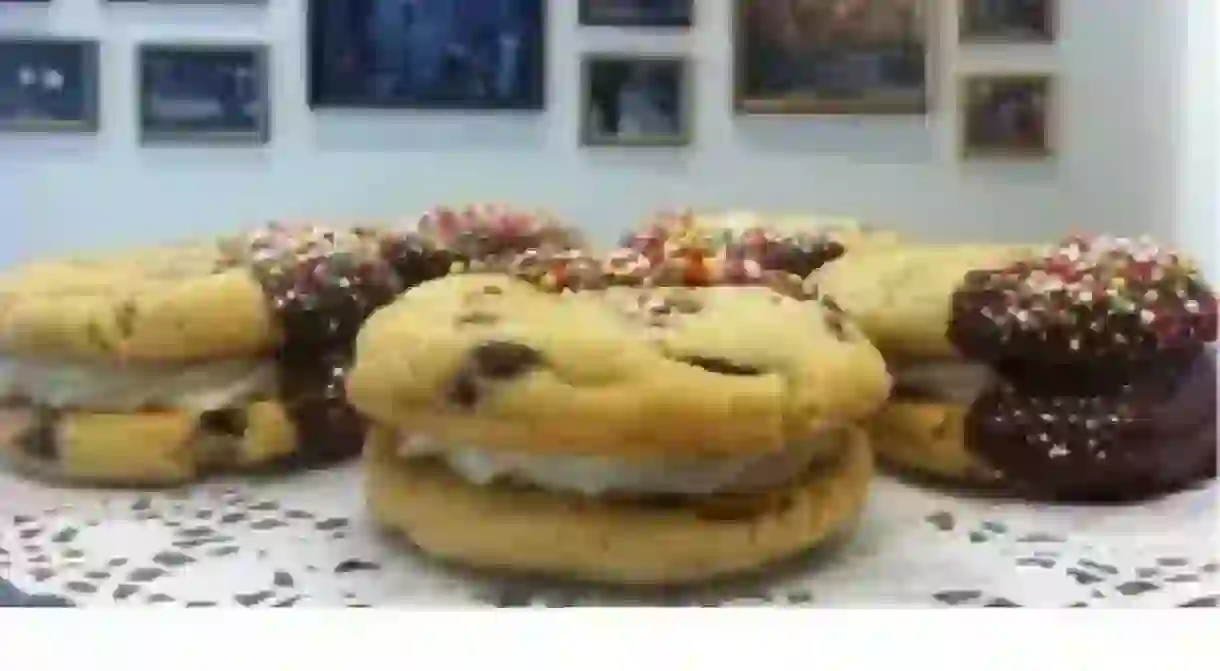 Chocolate chip cookie sandwich half dipped in fudge and sprinkles. [Courtesy of Red Velvet]