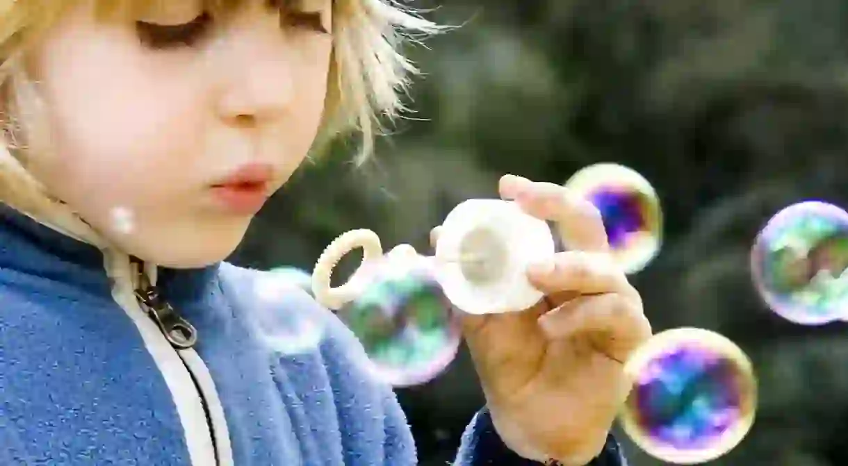 Child Blowing Bubbles