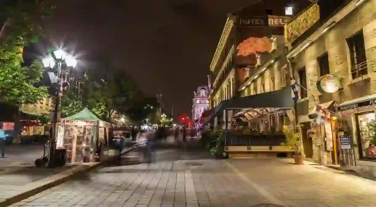 Old Town Montreal at night showing the blur of people