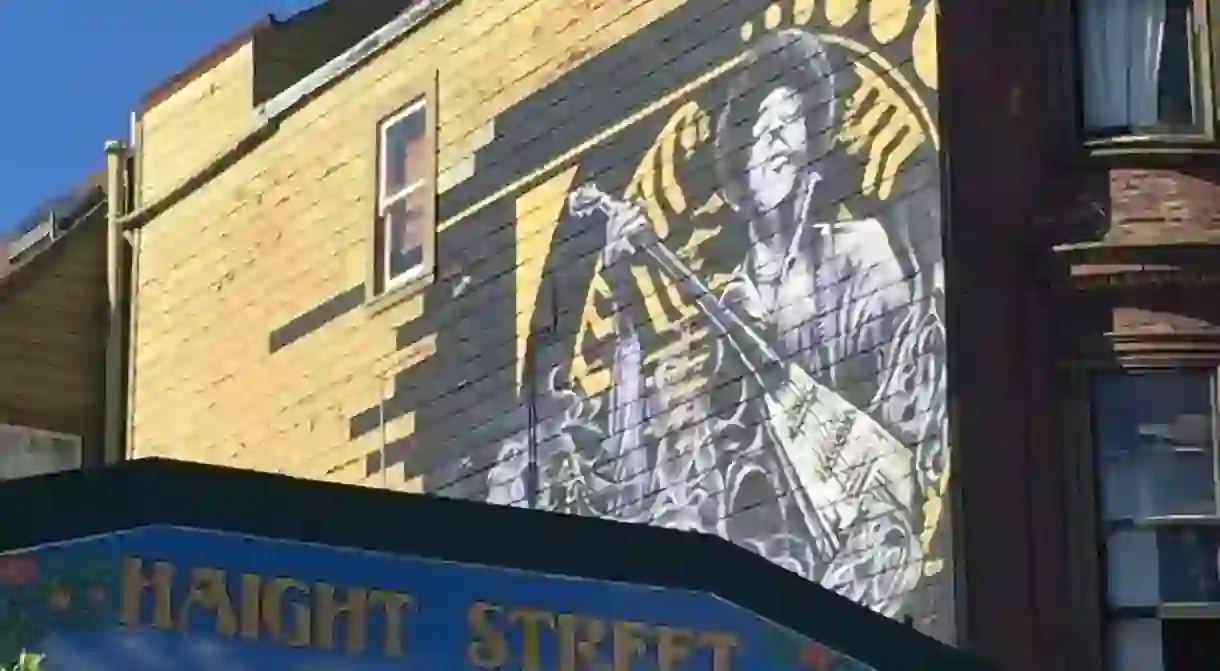 A portrait of Jimi Hendrix on the side of his former home