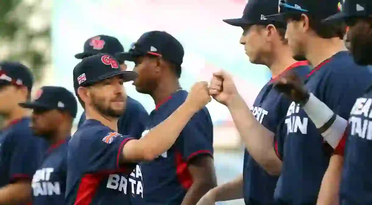 Great Britain manager Liam Carroll greets his players ahead of Game 2 of the 2016 World Baseball Classic Qualifier