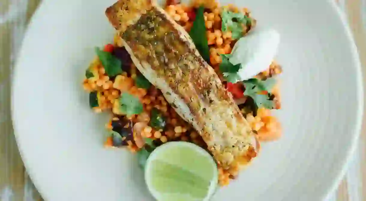 Grilled saltwater barramundi, spiced Mediterranean cous cous and house smoked yoghurt