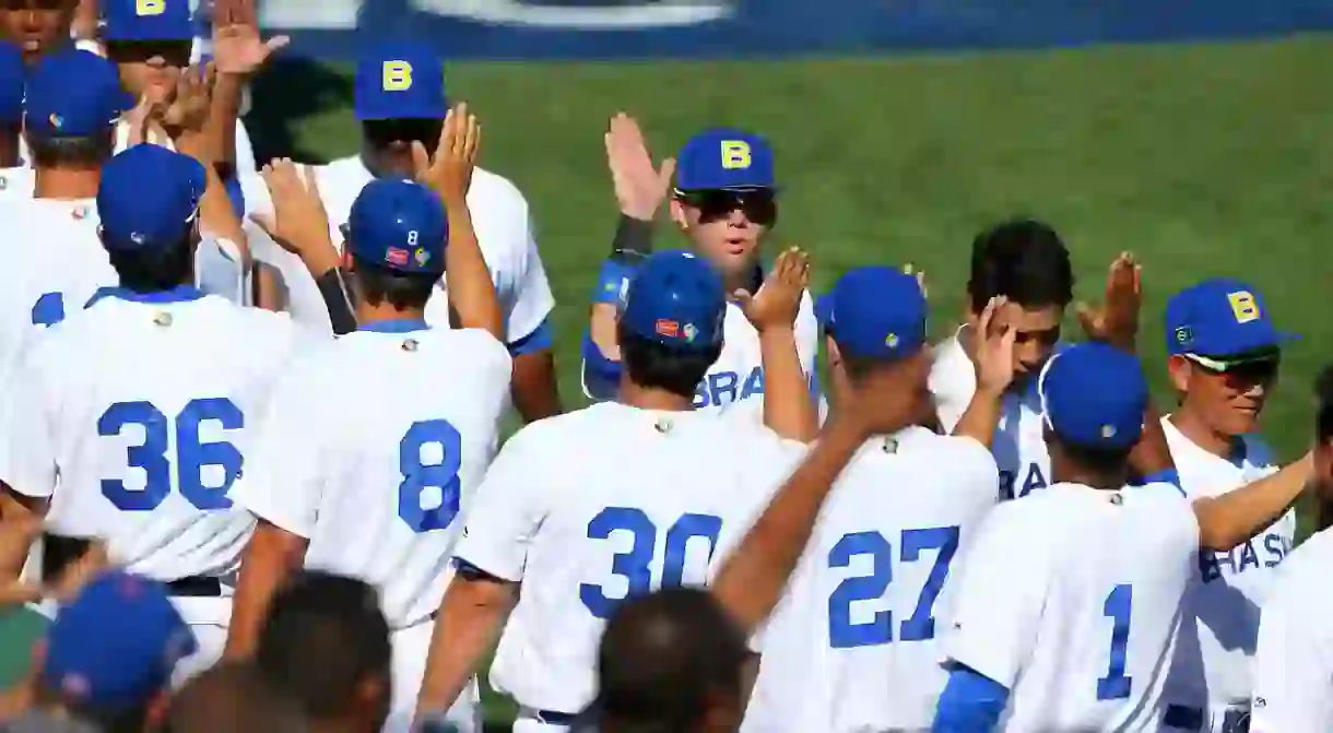 Members of Team Brazil celebrate after winning the opening game of the 2016 World Baseball Classic Qualifier