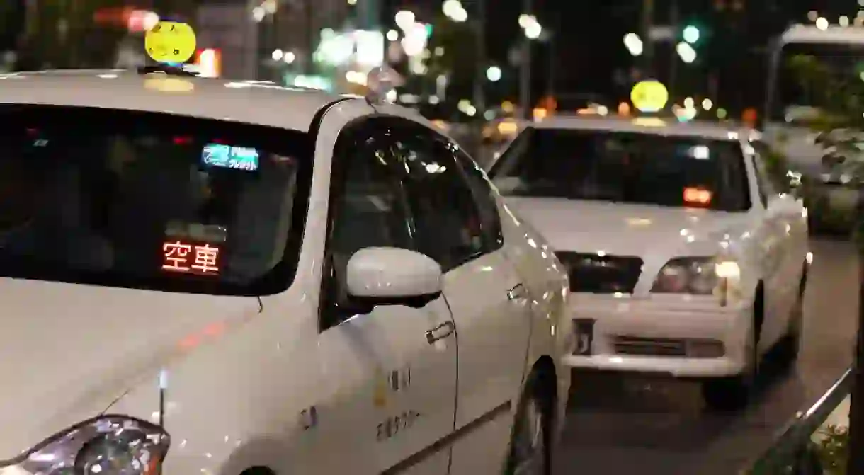 Taxis line up at a taxi stand in Tokyo