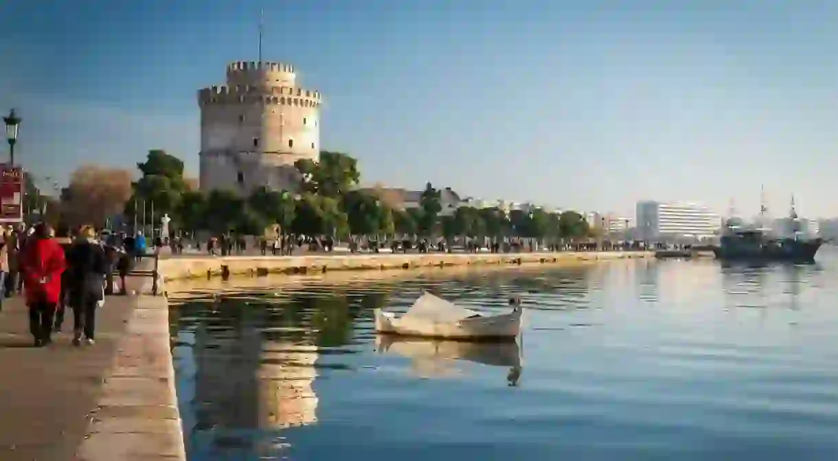 Thessaloniki next to the white tower which once guarded the eastern end of the citys seawalls