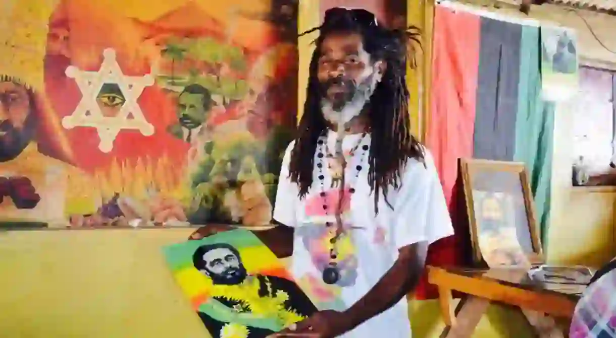 Artist Future with painting of Haile Selassie, Jah Moons, Hellshire Beach, Portmore