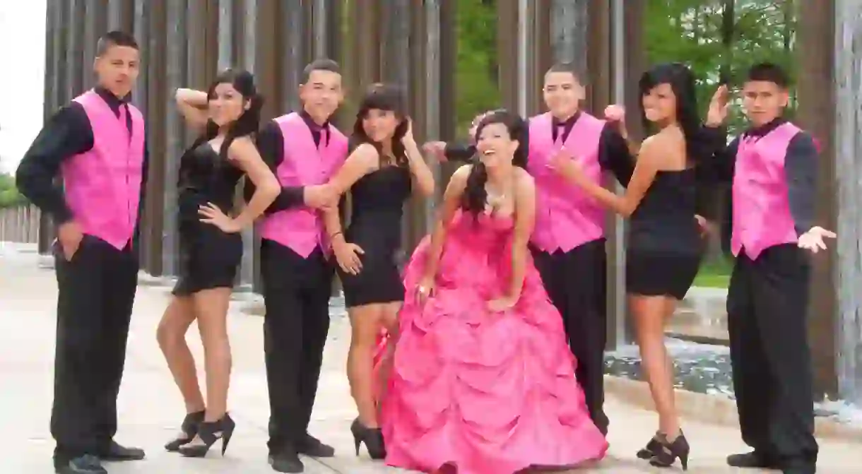 A quinceañera, her damas and chambelanes