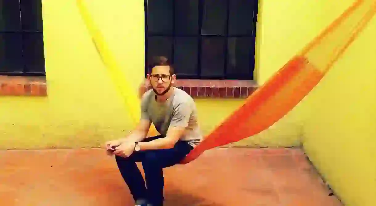 Man enjoying the hammock in a Mexico City hostel