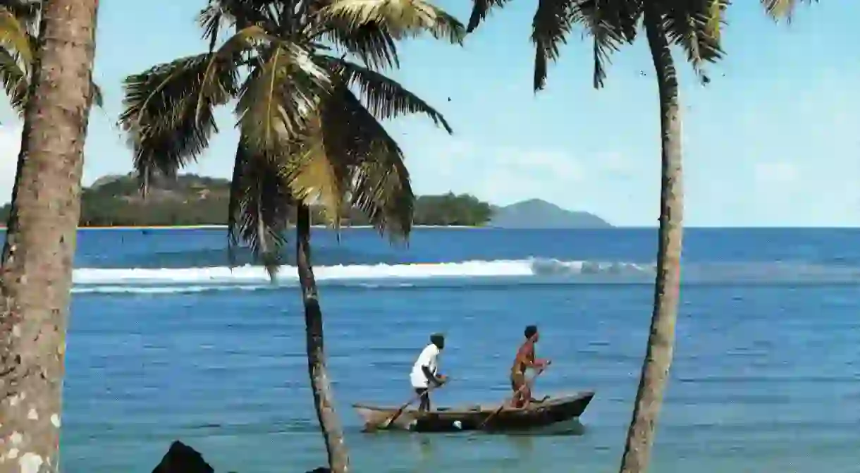 Local Fishermen on Wooden Pirogue in the 1970s.