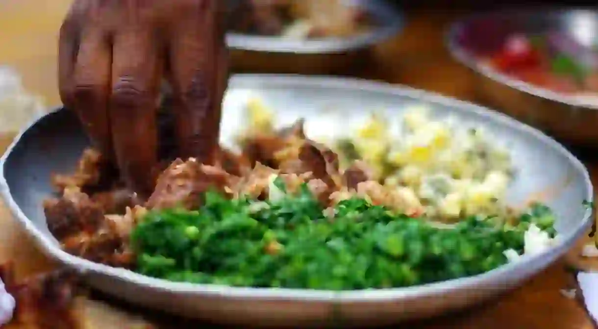 Nyama choma served with kienyeji and veggies