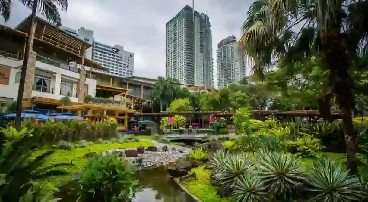 Gardens and skyscrapers at Greenbelt Park, in Ayala, Makati