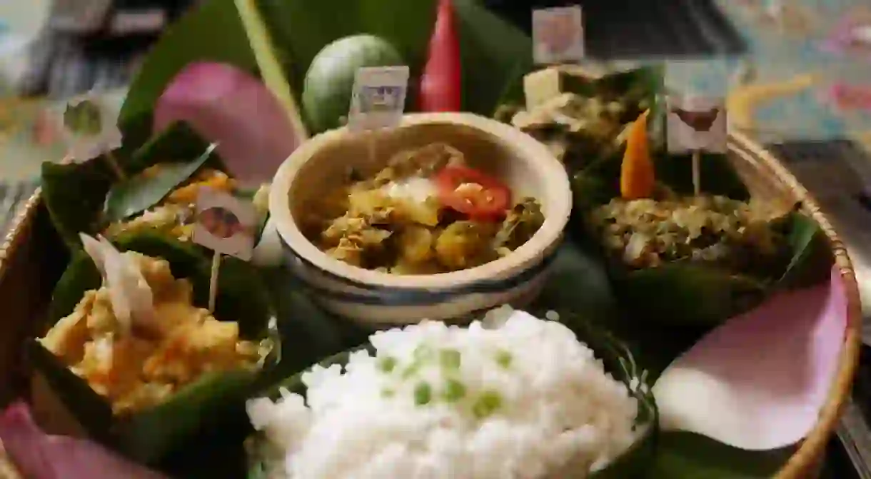 A tray full of all the ingredients that complete the traditional Cambodian dish, fish amok