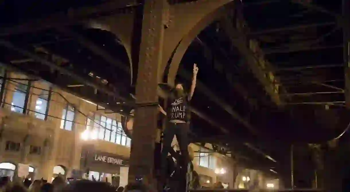 A woman protests the election of Donald Trump in Chicago