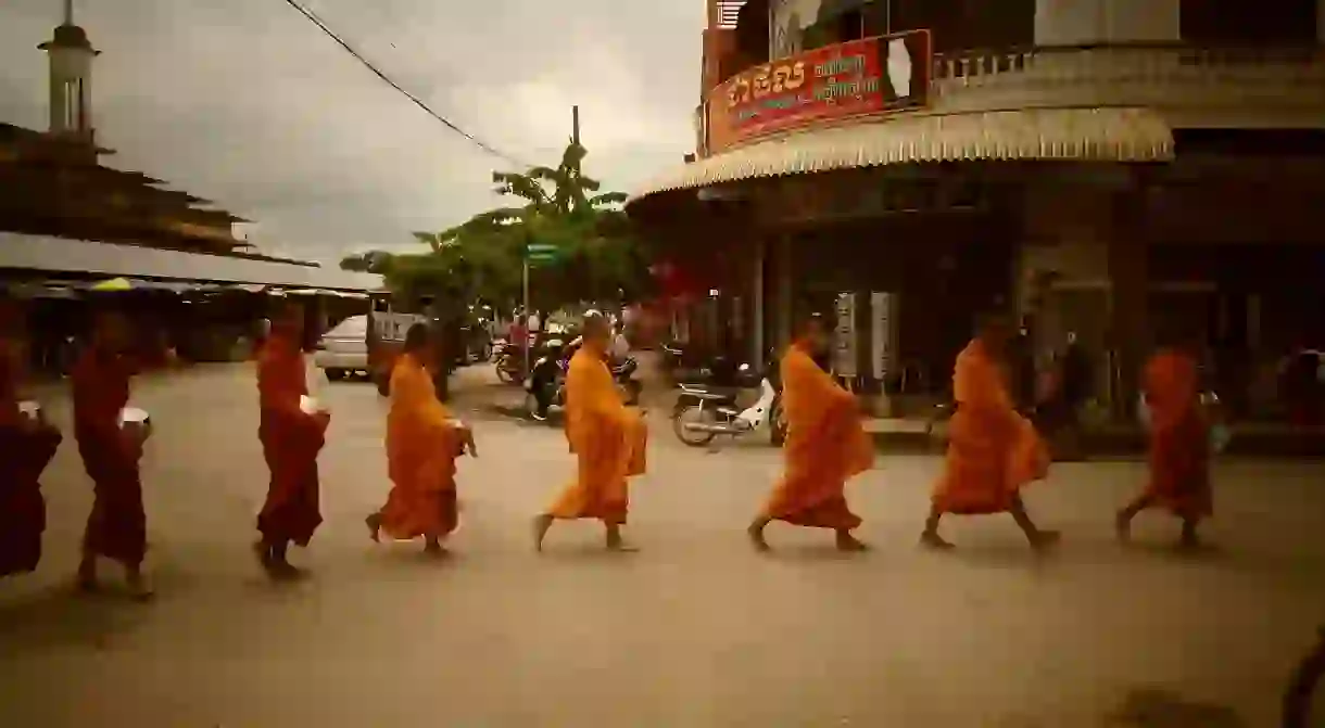 Monks on their morning collection of offerings in Battambang, Cambodia