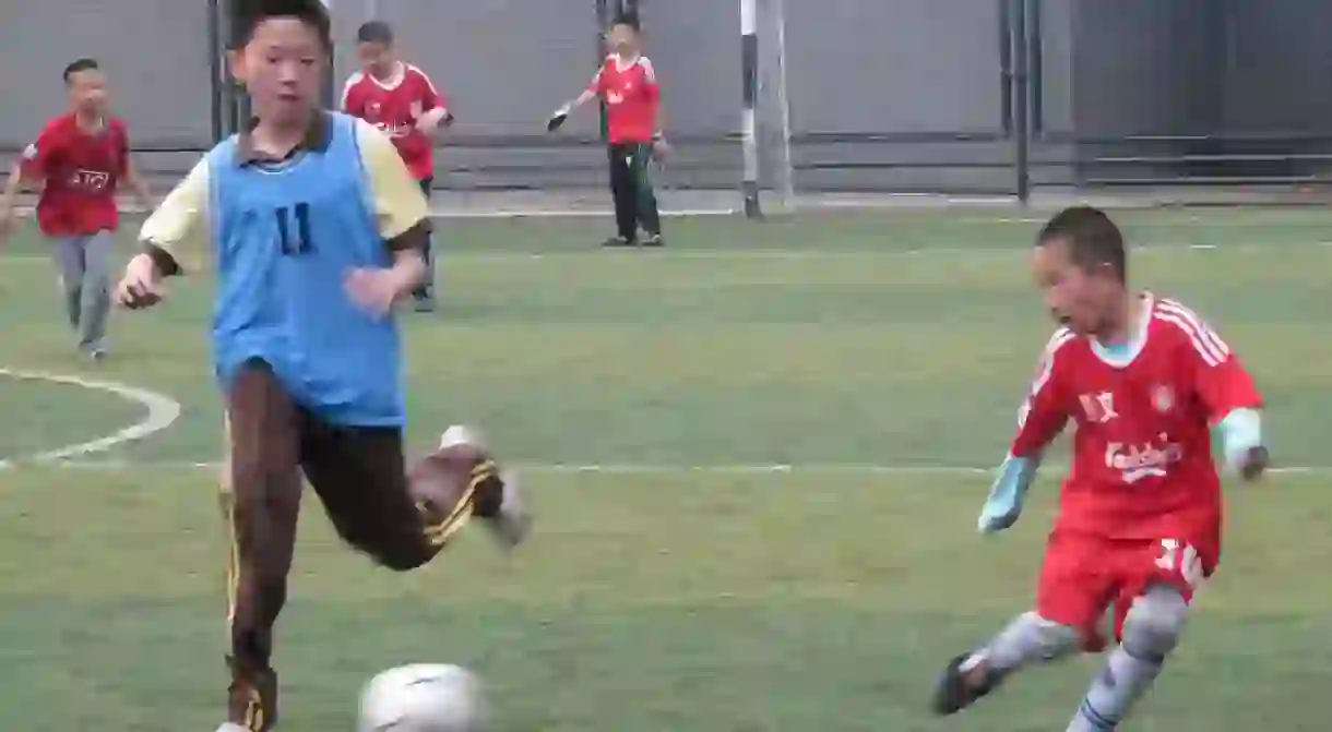 Kids playing soccer in Beijing