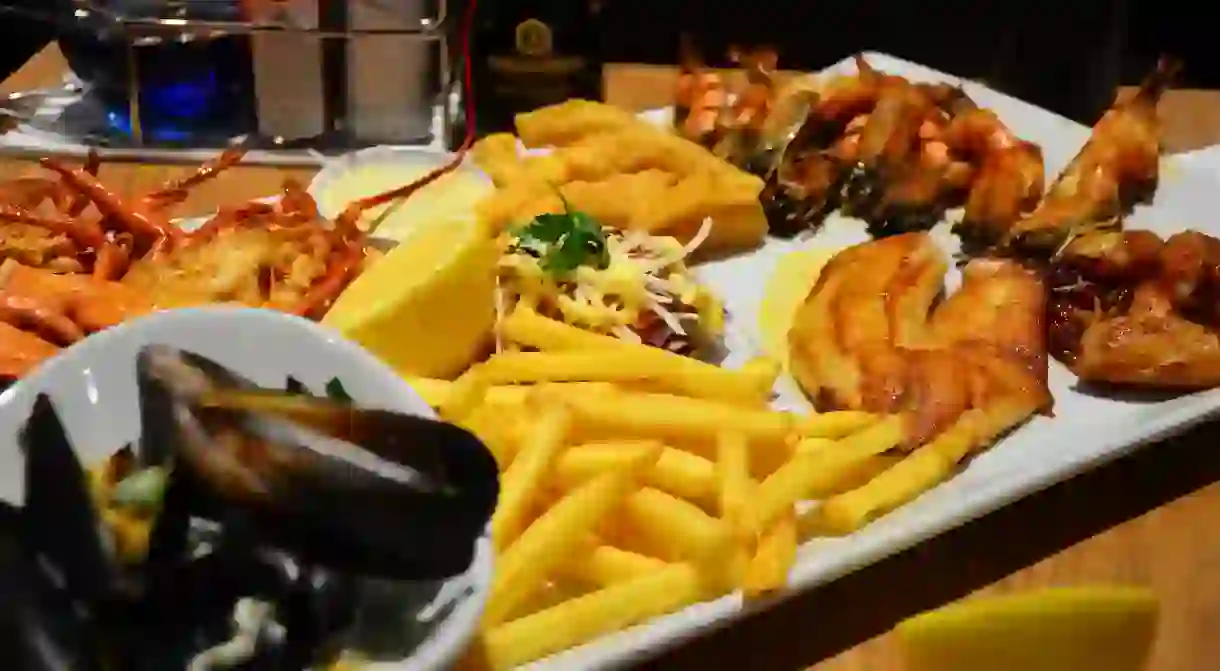 Seafood platter with fish, prawns, mussels and chips