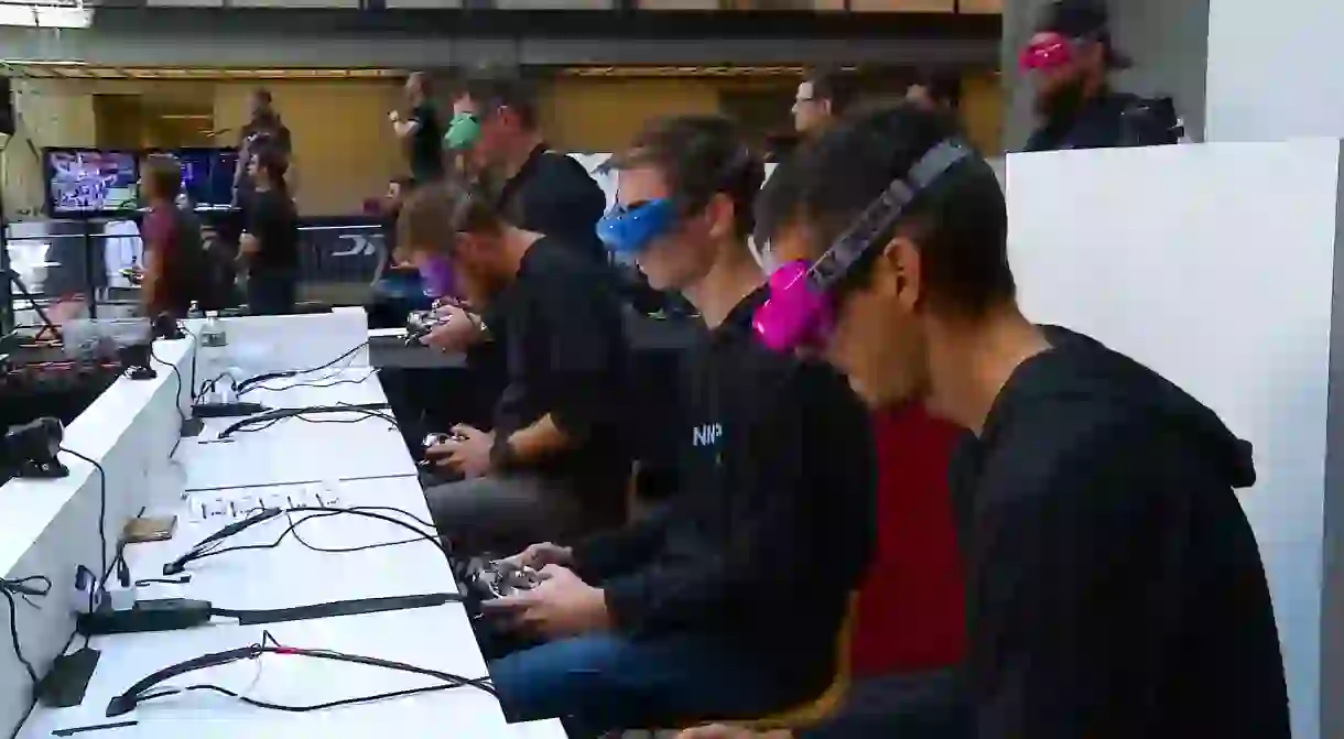 Drone Racing League pilots wear headsets to fly their drones via first-person view