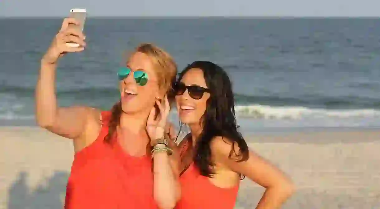 Friends taking a selfie at the beach