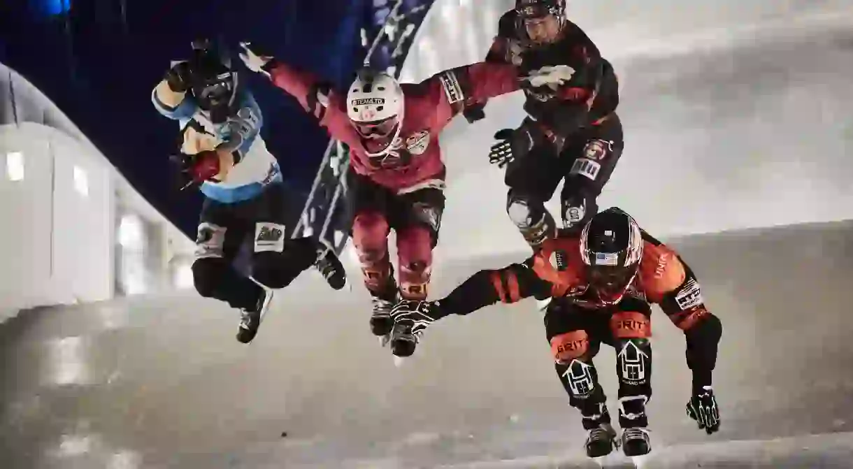 Crashed Ice competitors Cameron Naasz, Dean Moriarity, Marco Dallago, Kyle Croxall take a jump