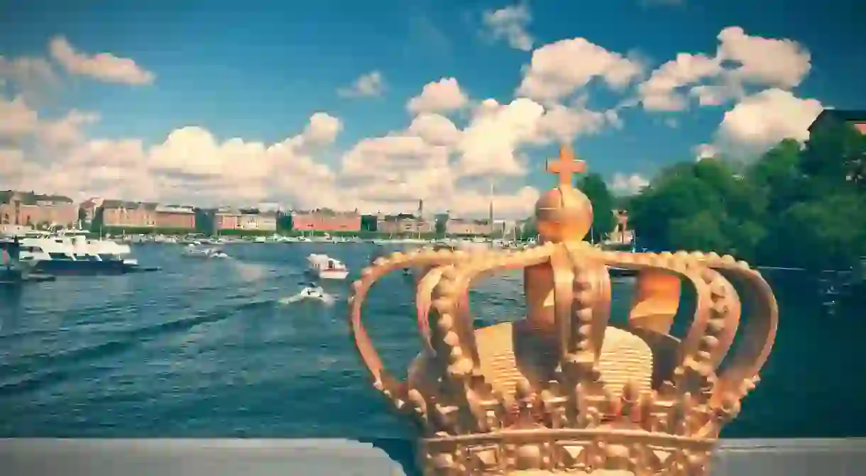 Stockholm, Sweden. Skeppsholmsbron (Skeppsholm Bridge) with its famous gilded crown and Strandvagen in background