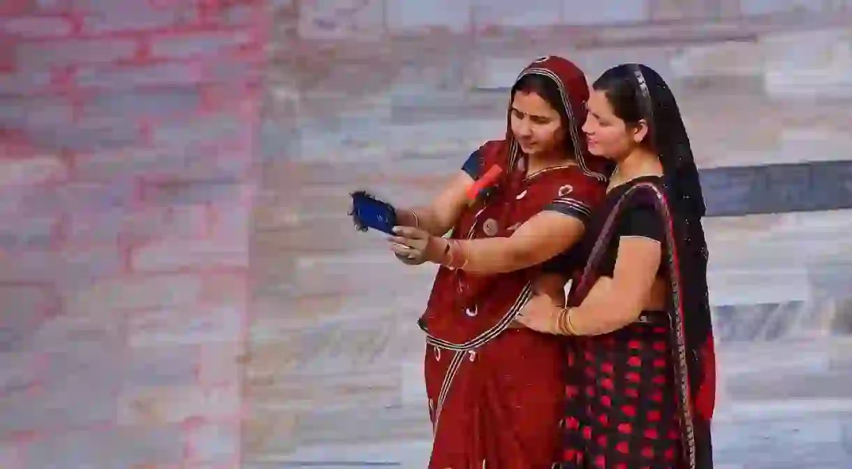 Indian women using cell phones.