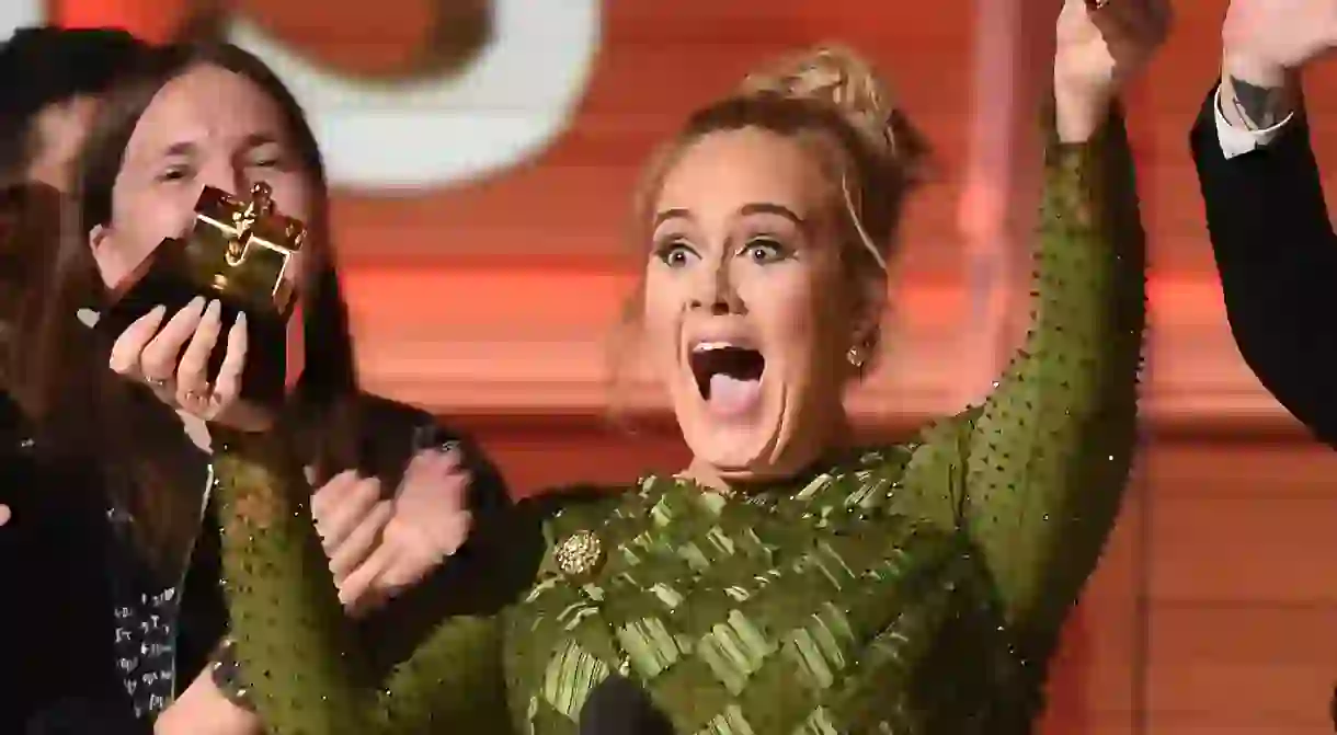 Adele breaks her Album of the Year Grammy in half