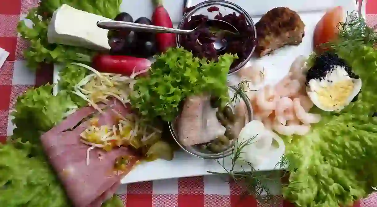 A smørrebrød plate including herring