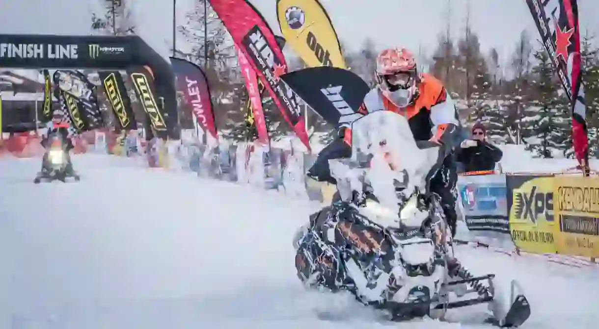 Racers cruise through the finish line at the 2017 Iron Dog in Fairbanks, Alaska