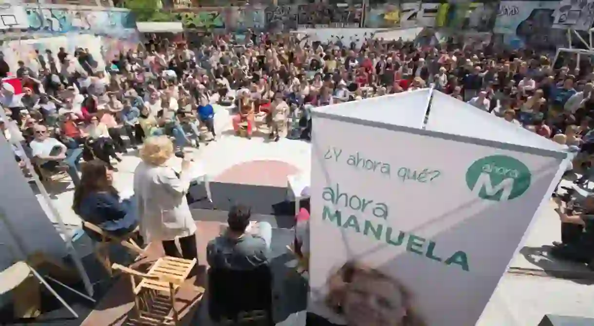 Manuela Carmena addresses a crowd in Madrid