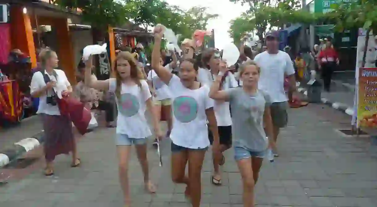 The Bye Bye Plastic Bag team march through the streets in protest against plastic pollution