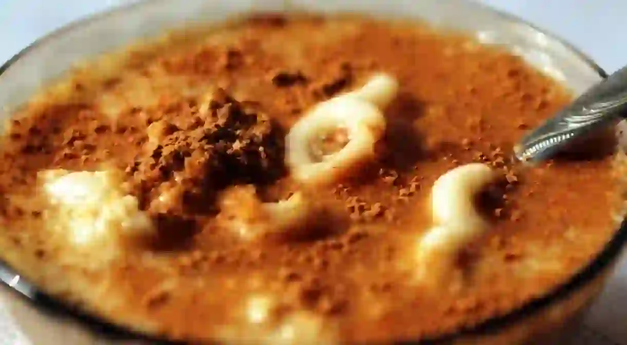 Mucenici seasoned with sugar, cinnamon and walnuts