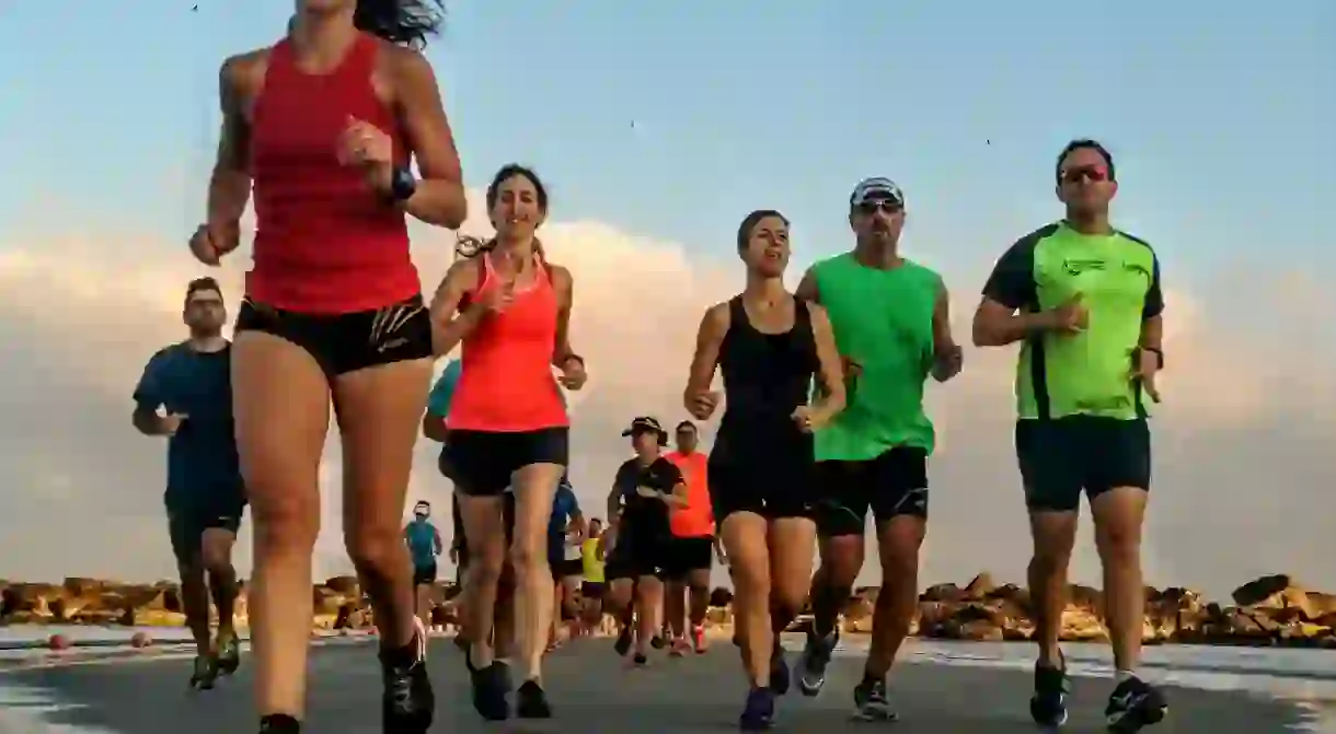 A group of runners at Tel Avivs Gordon Beach