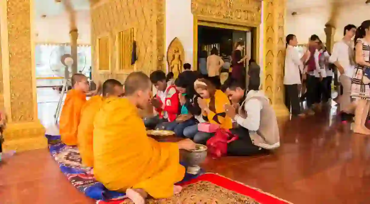 Cambodians visit pagodas during Khmer New Year to give offerings