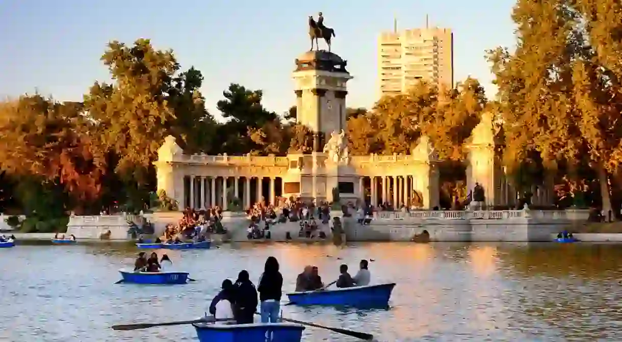 People enjoy spring evening in Buen Retiro park