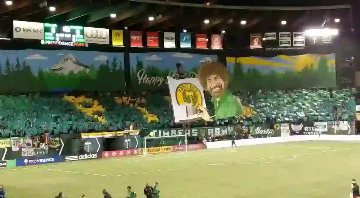 The Timbers Army holds up a Bob Ross-inspired tifo ahead of the teams 2017 opener