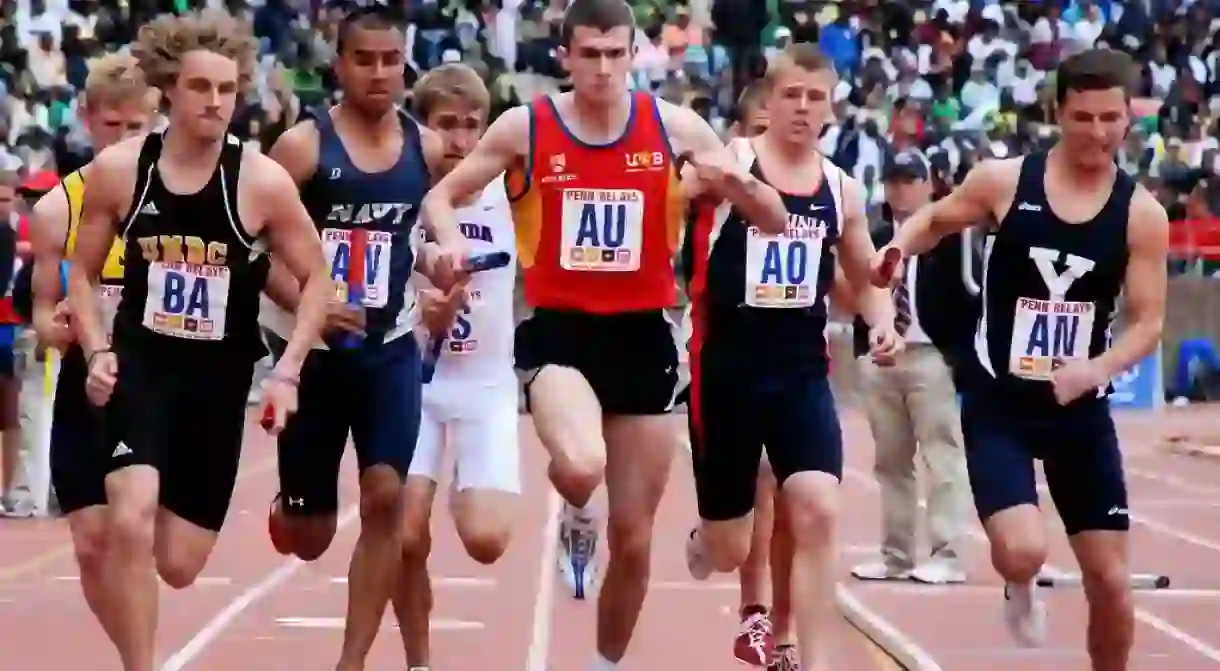 A collegiate relay race at the Penn Relays