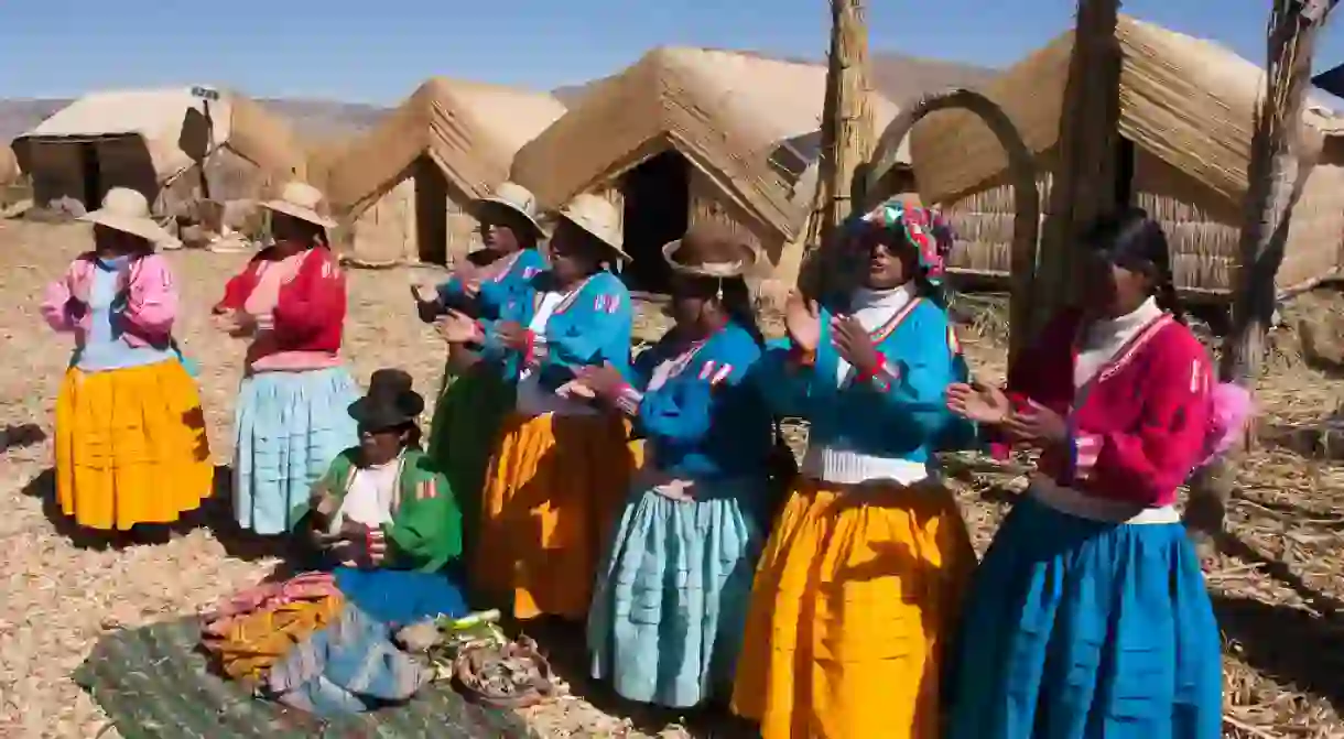 Peruvian Aymara women chanting in their native language.