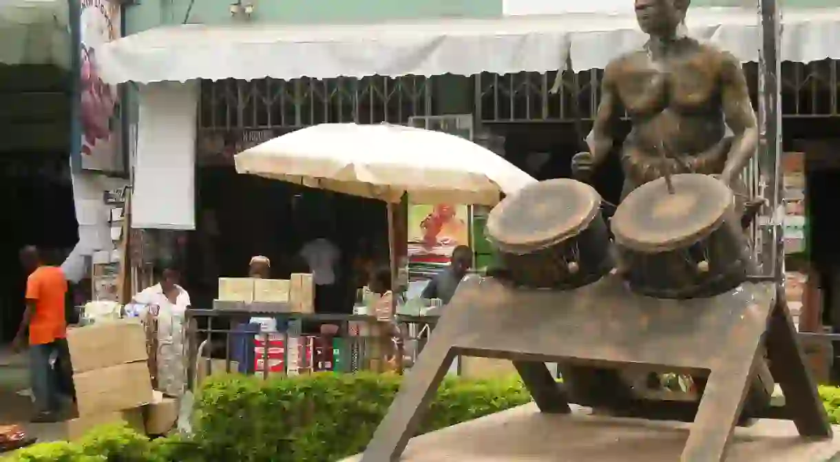 Street Scene with Sculpture of Drummer - Kumasi - Ghana