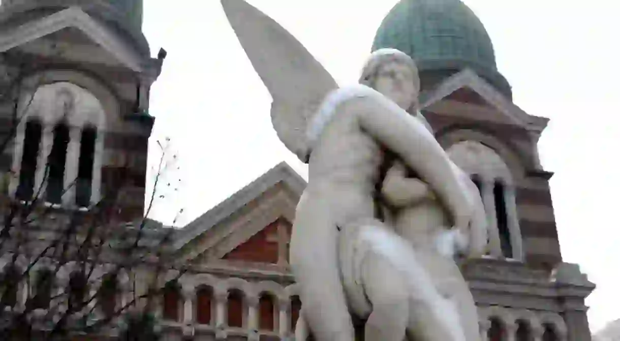 An angel statue in front of the French church at Binjiang Dao